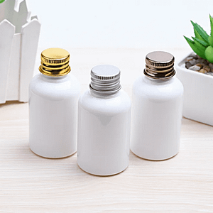 white plastic bottles with aluminum screw lids